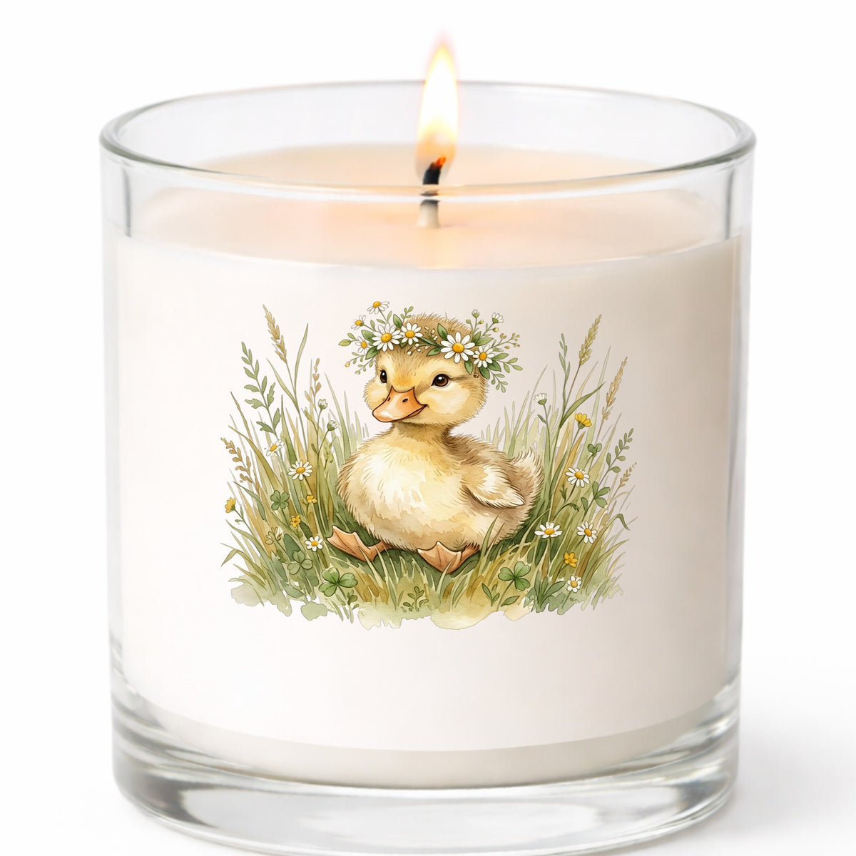 Duckling With Daisy Crown In Grass UV DTF sticker applied to a white candle in a clear glass jar
