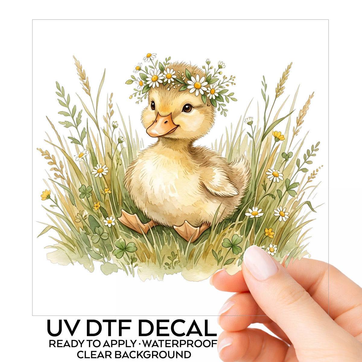 Duckling With Daisy Crown In Grass UV DTF sticker on its backing card, held in hand