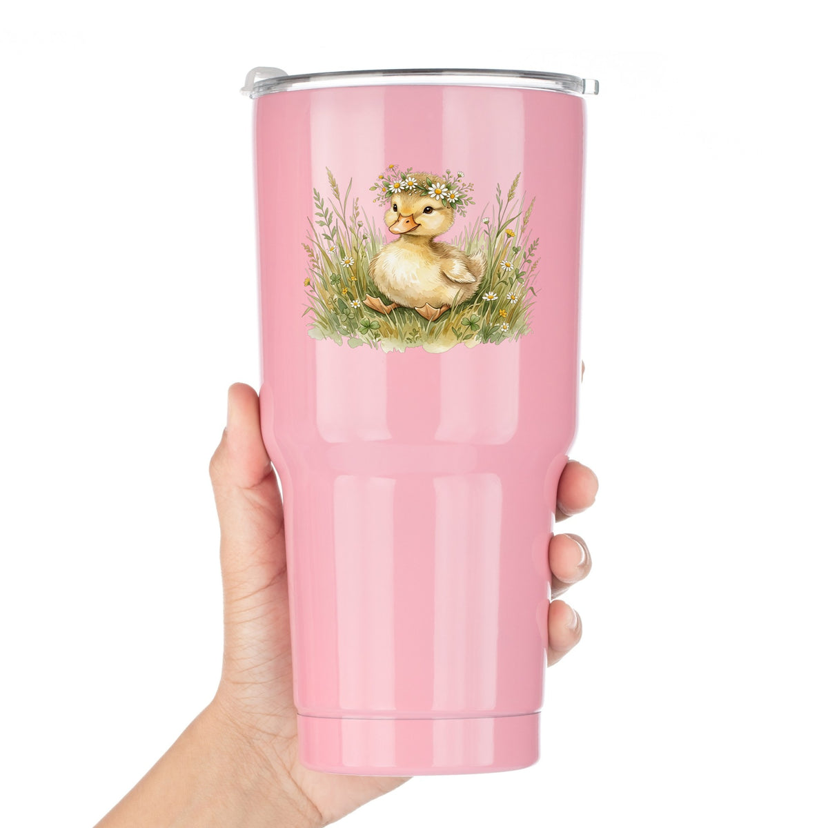 Duckling With Daisy Crown In Grass UV DTF sticker applied to a pink tumbler held against a white background