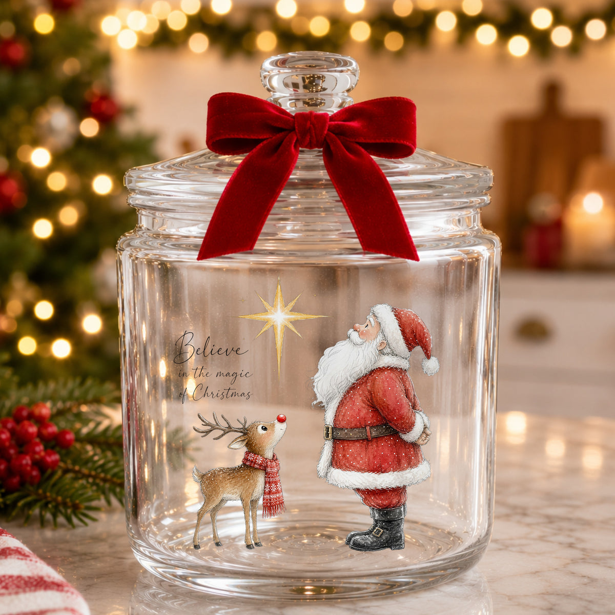 Believe Santa And Reindeer UV DTF sticker applied to a glass candy jar tied with a red bow