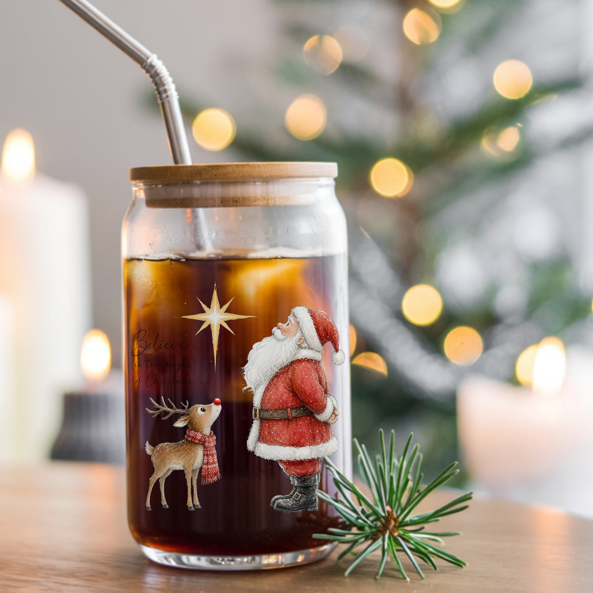 Believe Santa And Reindeer UV DTF sticker applied to a glass can cup of iced coffee with a straw
