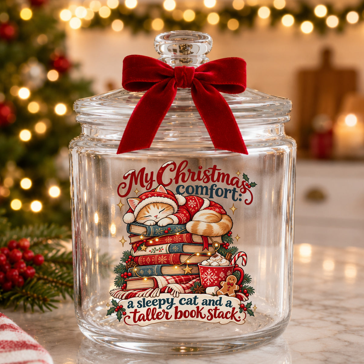 Sleepy Christmas Cat On Book Stack UV DTF sticker applied to a glass candy jar tied with a red bow