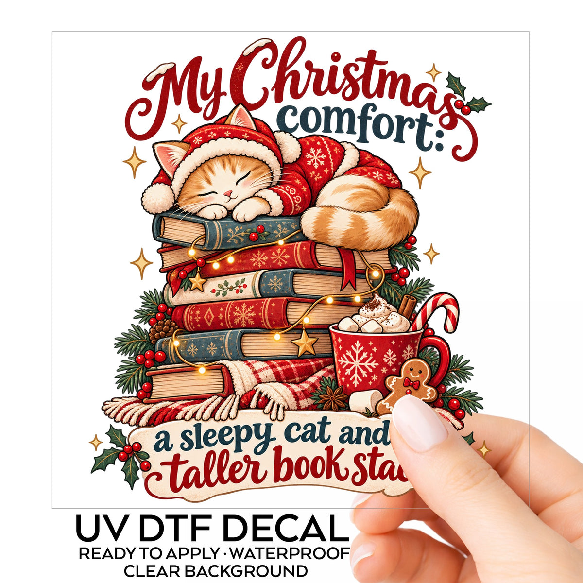 Sleepy Christmas Cat On Book Stack UV DTF sticker on its backing card, held in hand