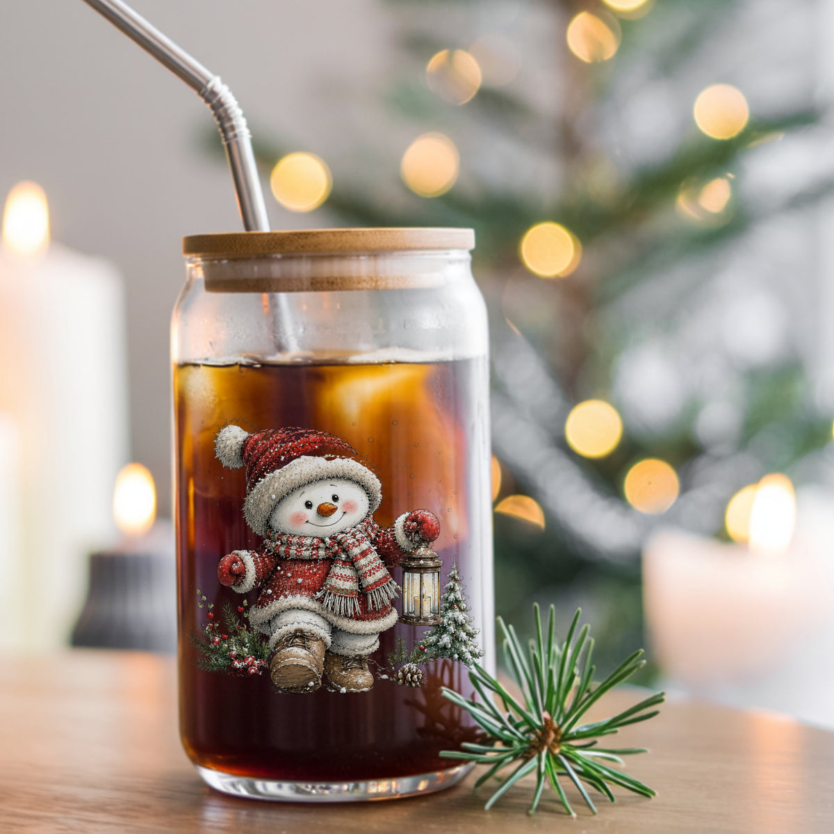 Snowman In Red Knit Coat With Lantern UV DTF sticker applied to a glass can cup of iced coffee with a straw