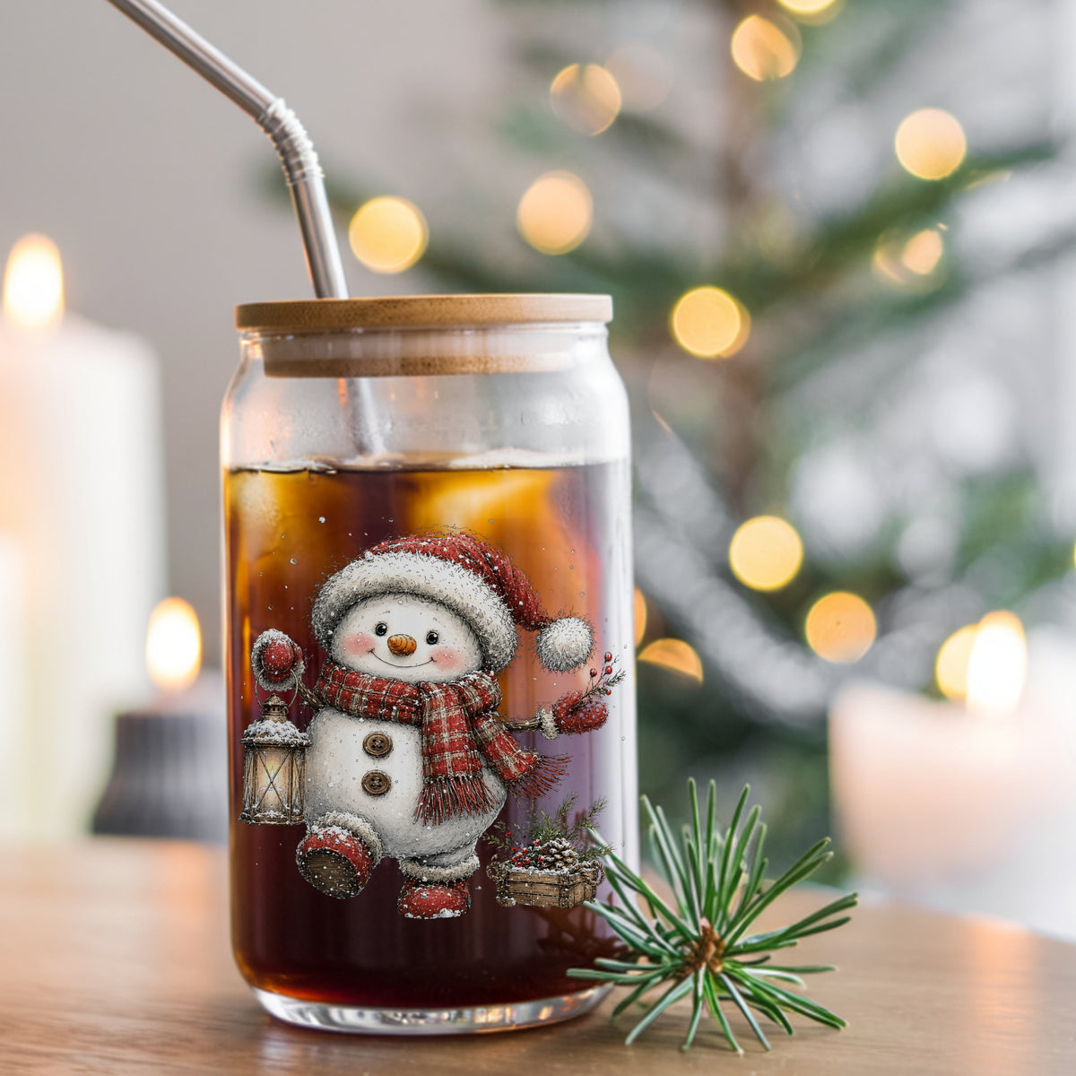 Plaid Scarf Snowman In Red Boots UV DTF sticker applied to a glass can cup of iced coffee with a straw