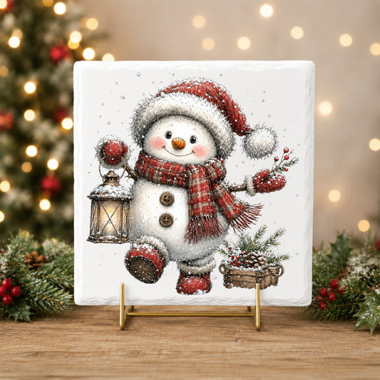 Plaid Scarf Snowman In Red Boots UV DTF sticker applied to a white tile on a gold stand