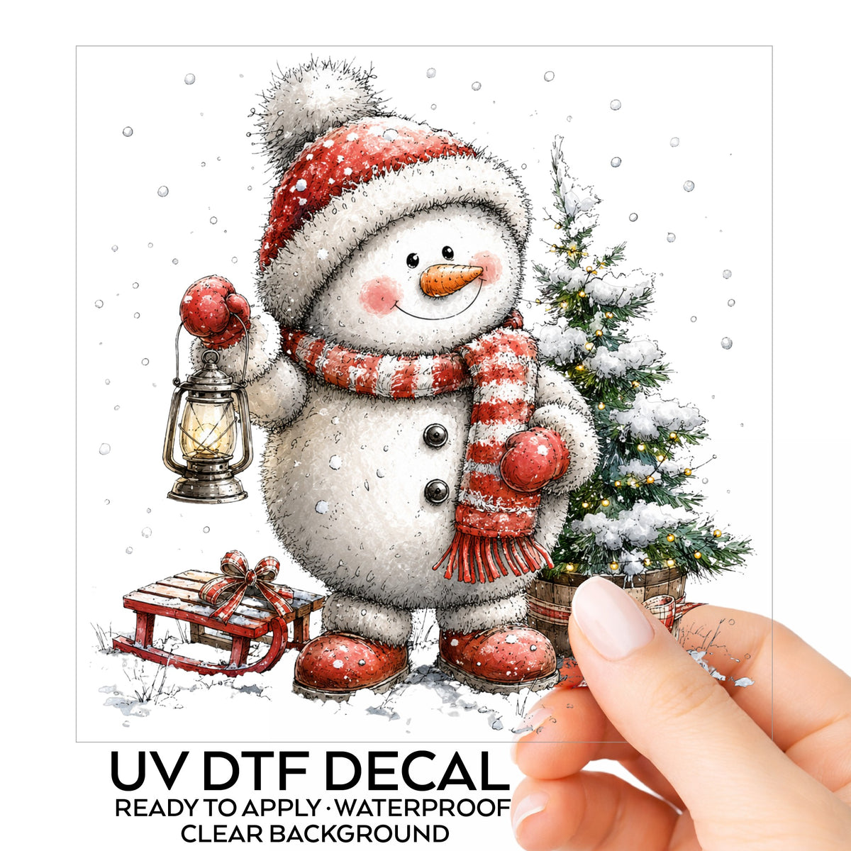 Striped Scarf Snowman With Lantern UV DTF sticker on its backing card, held in hand