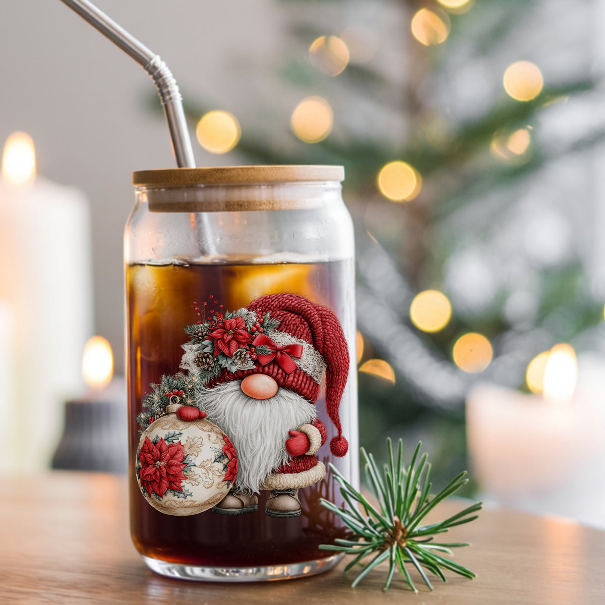 Christmas Gnome With Poinsettia Ornament UV DTF sticker applied to a glass can cup of iced coffee with a straw