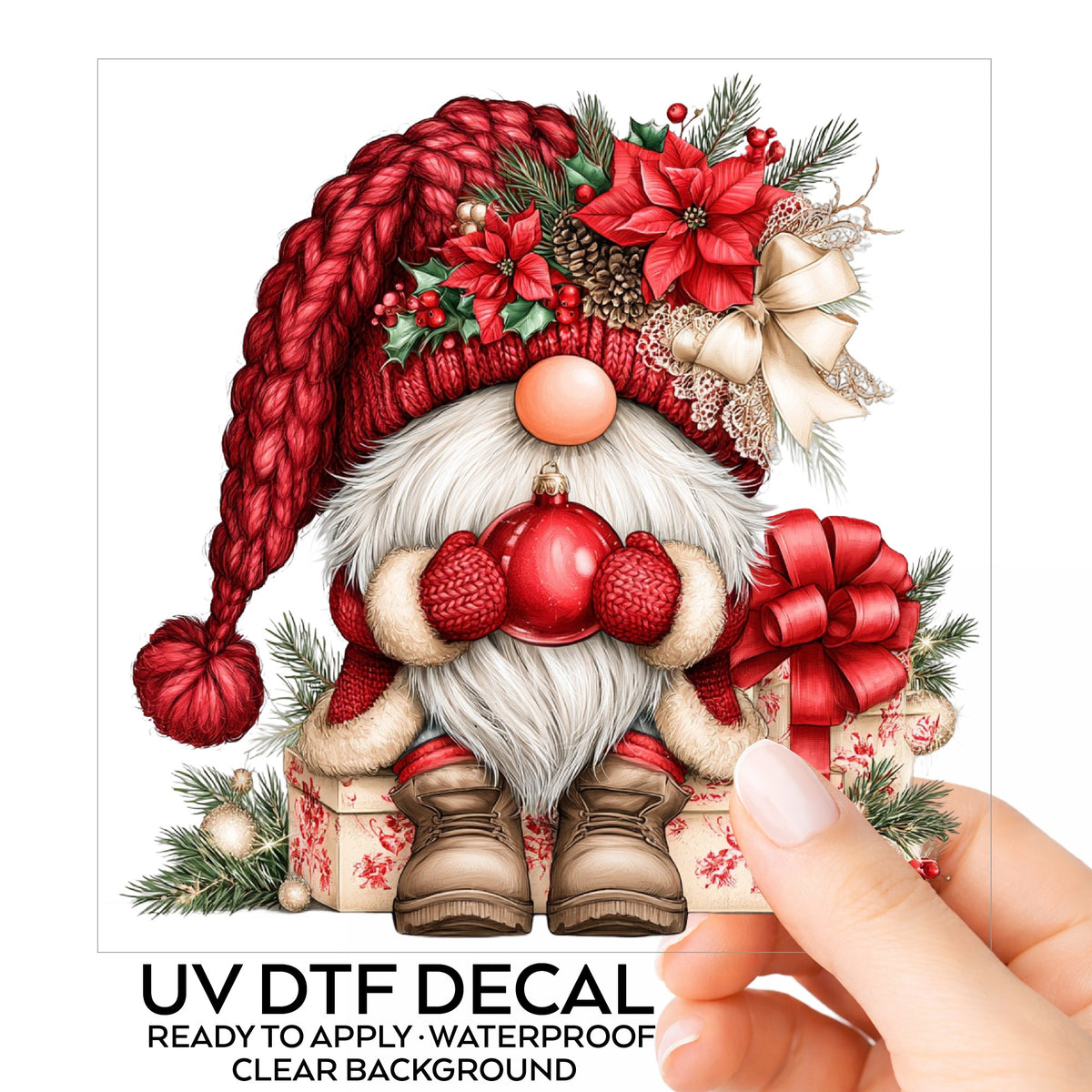 Gnome Holding Red Ornament UV DTF sticker on its backing card, held in hand