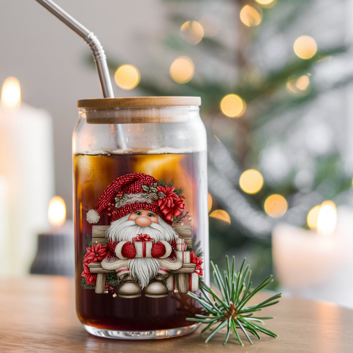 Gnome Sitting On Bench With Poinsettias UV DTF sticker applied to a glass can cup of iced coffee with a straw