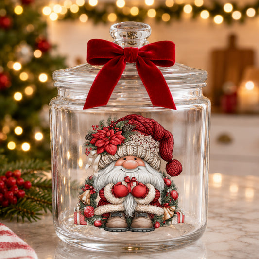 Gnome With Gold Bells And Cream Hat UV DTF sticker applied to a glass candy jar tied with a red bow