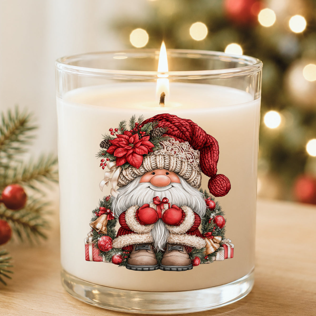 Gnome With Gold Bells And Cream Hat UV DTF sticker applied to a white candle in a glass holder near Christmas lights