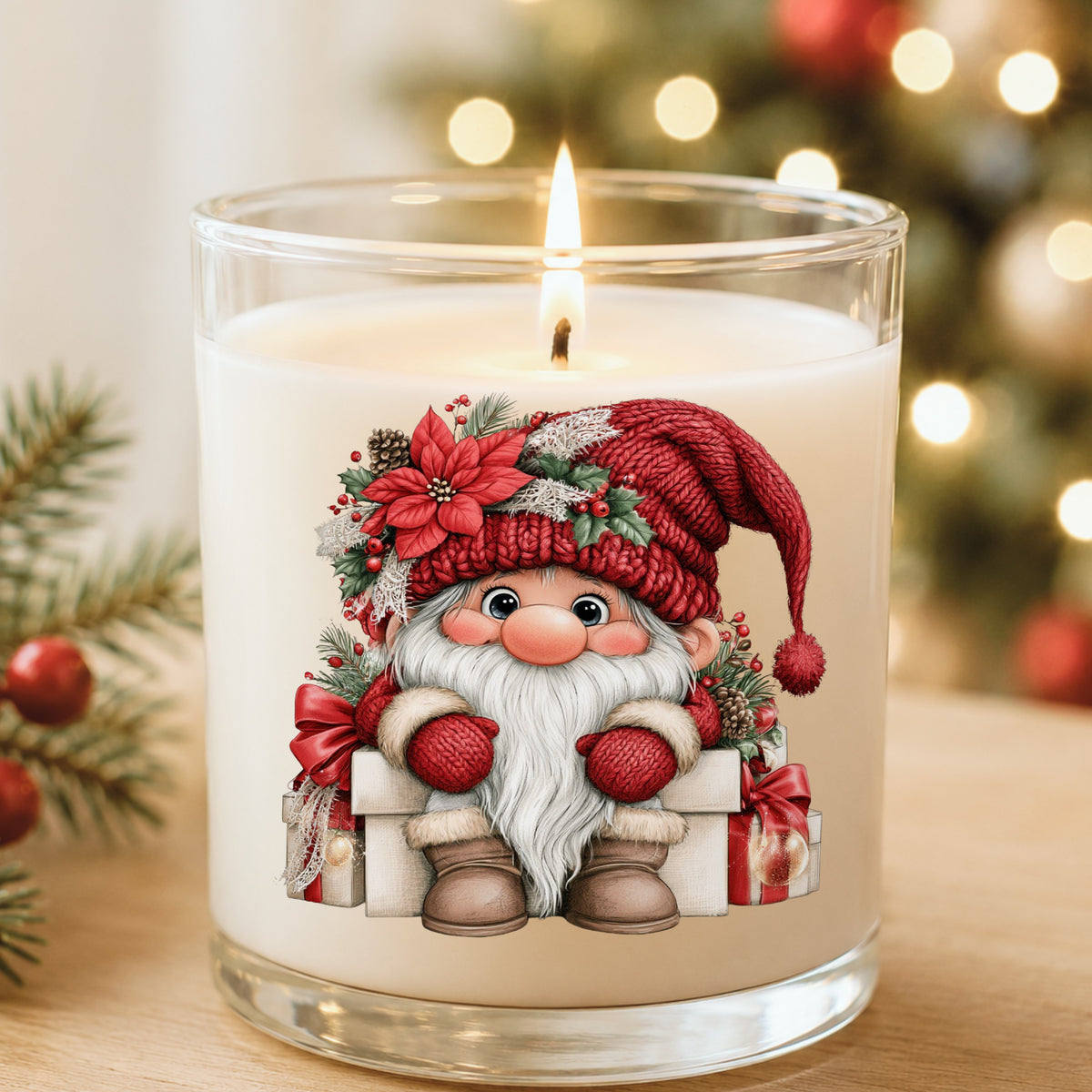 Gnome Sitting On Gift Boxes UV DTF sticker applied to a white candle in a glass holder near Christmas lights