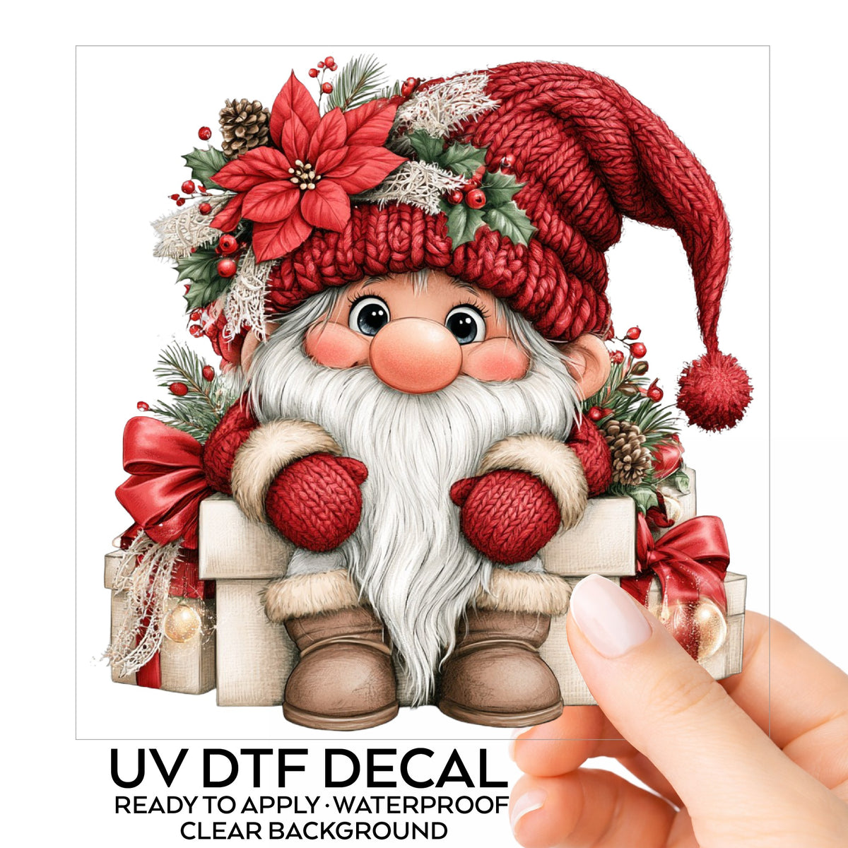 Gnome Sitting On Gift Boxes UV DTF sticker on its backing card, held in hand
