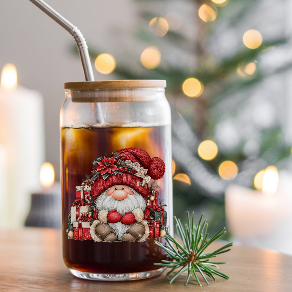 Gnome With Pile Of Presents UV DTF sticker applied to a glass can cup of iced coffee with a straw