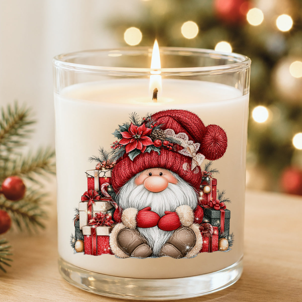 Gnome With Pile Of Presents UV DTF sticker applied to a white candle in a glass holder near Christmas lights