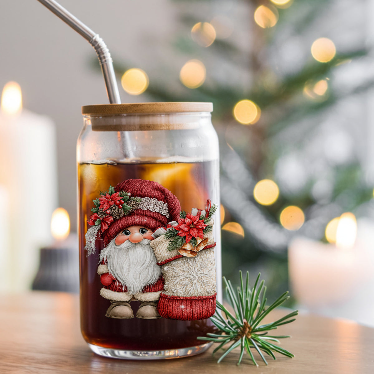 Gnome With Knit Christmas Stocking UV DTF sticker applied to a glass can cup of iced coffee with a straw