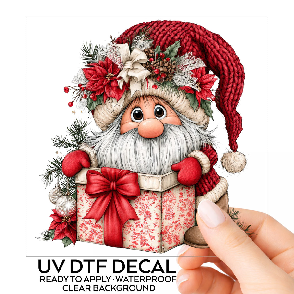 Gnome Peeking From Gift Box UV DTF sticker on its backing card, held in hand