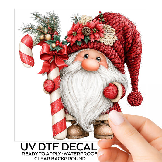 Candy Cane Gnome UV DTF sticker on its backing card, held in hand