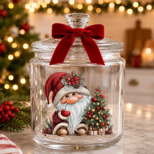Gnome With Decorated Christmas Tree UV DTF sticker applied to a glass candy jar tied with a red bow