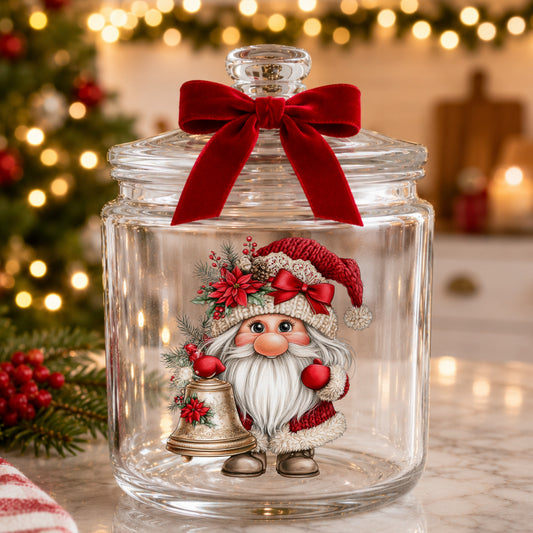 Gnome With Brass Bell UV DTF sticker applied to a glass candy jar tied with a red bow