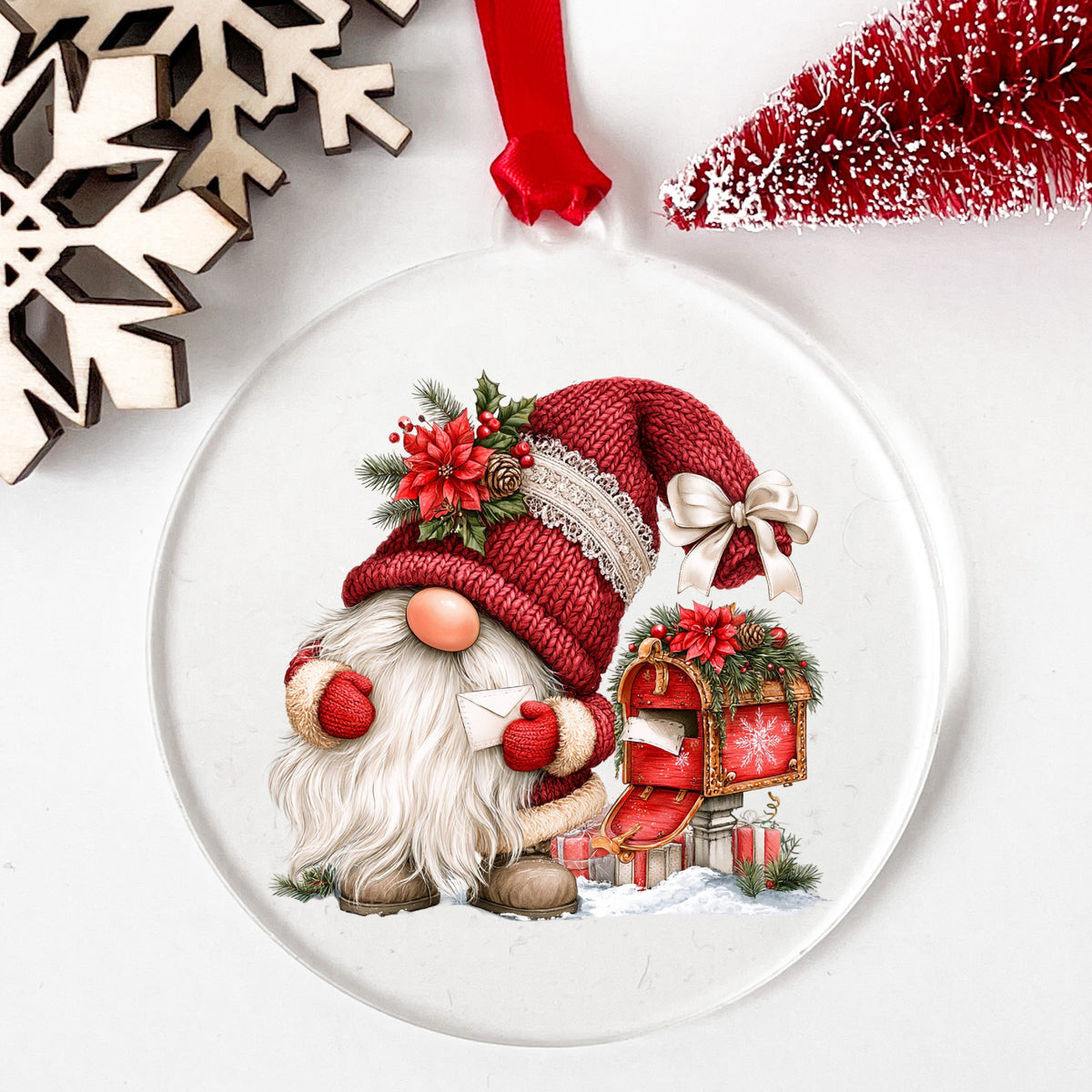 Gnome With Envelope And Open Mailbox UV DTF sticker applied to a clear round acrylic ornament with a red ribbon