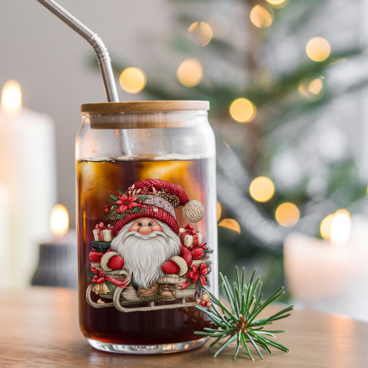 Gnome Riding Wooden Sleigh With Gifts UV DTF sticker applied to a glass can cup of iced coffee with a straw