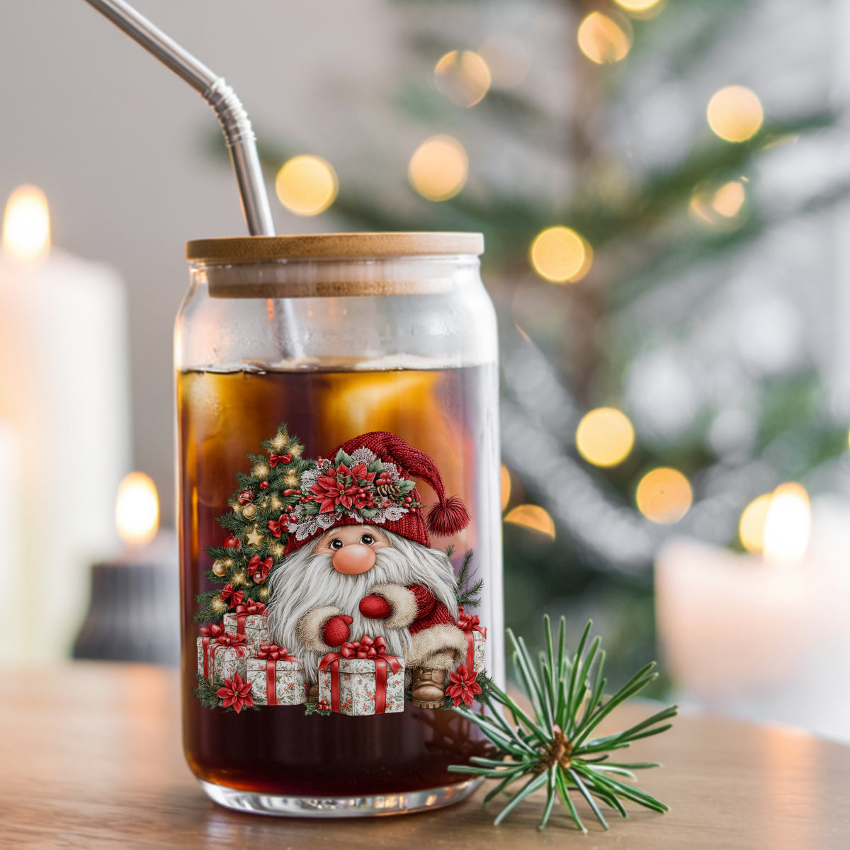 Gnome With Wrapped Presents And Lighted Tree UV DTF sticker applied to a glass can cup of iced coffee with a straw