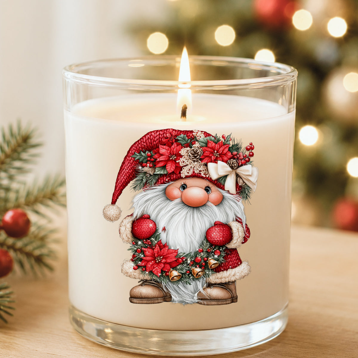 Gnome Holding Poinsettia Garland UV DTF sticker applied to a white candle in a glass holder near Christmas lights