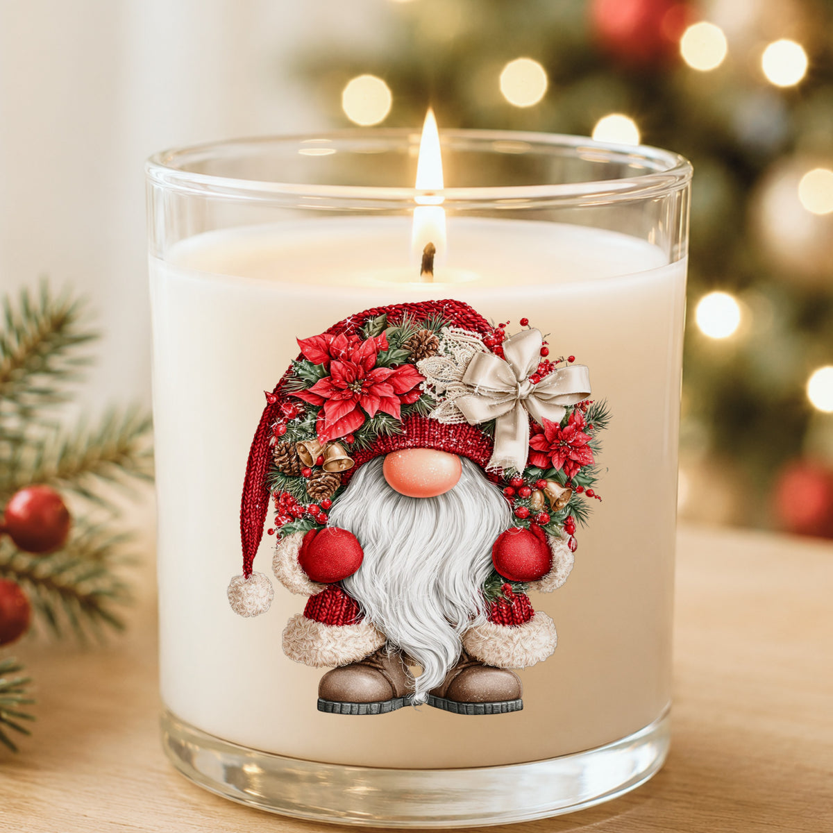 Scandinavian Gnome With Bells And Bow UV DTF sticker applied to a white candle in a glass holder near Christmas lights