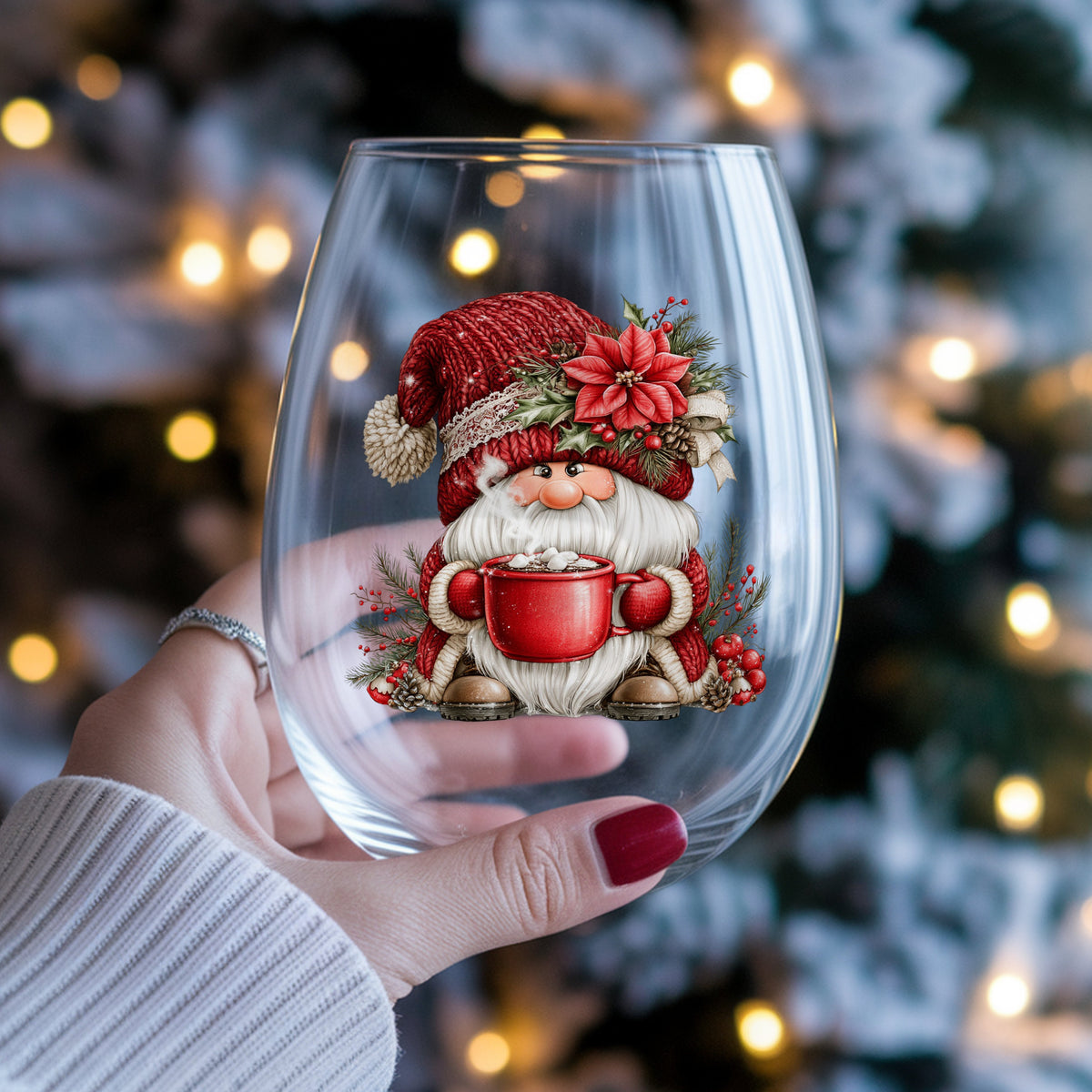 Hot Cocoa Gnome UV DTF sticker applied to a stemless wine glass held in hand