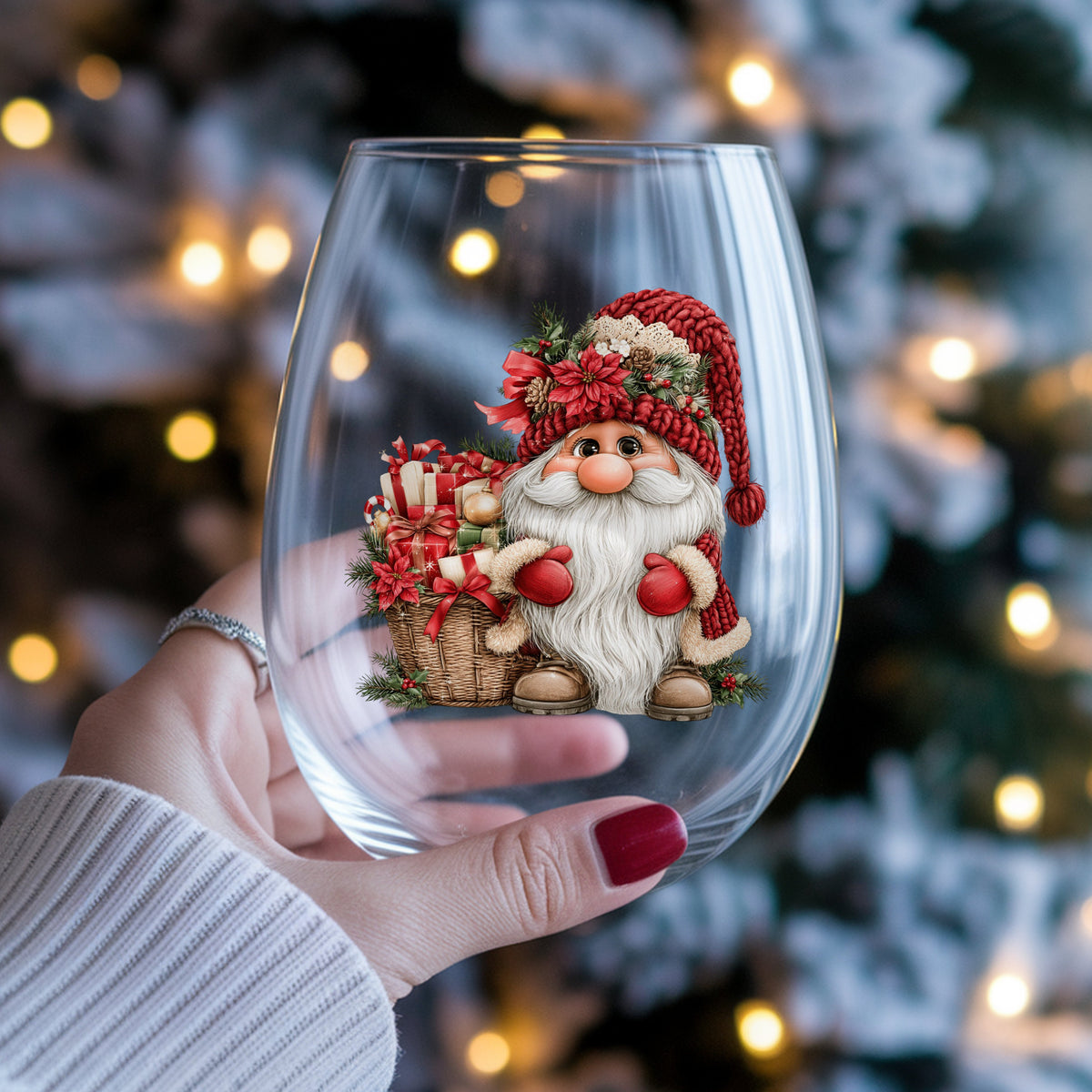 Gnome With Gift Basket UV DTF sticker applied to a stemless wine glass held in hand