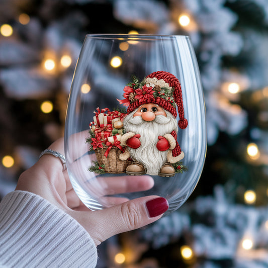 Gnome With Gift Basket UV DTF sticker applied to a stemless wine glass held in hand