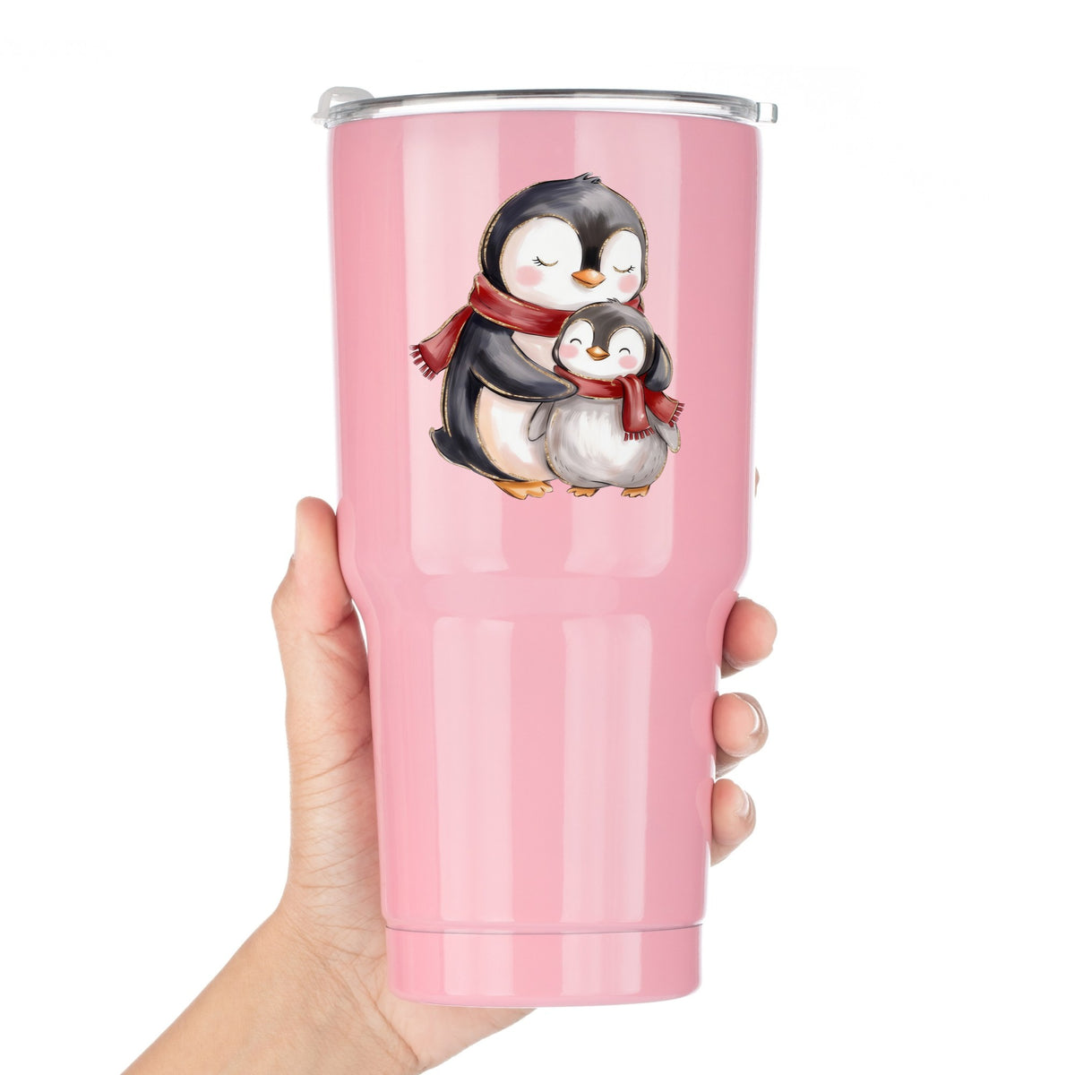 Mama And Baby Penguin In Red Scarves UV DTF sticker applied to a pink tumbler held against a white background