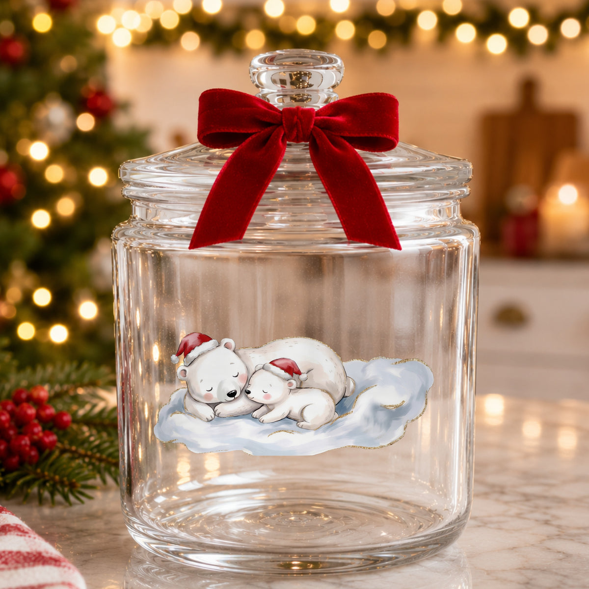 Sleeping Polar Bear And Cub In Santa Hats UV DTF sticker applied to a glass candy jar tied with a red bow
