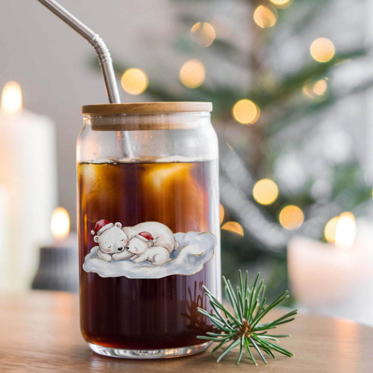Sleeping Polar Bear And Cub In Santa Hats UV DTF sticker applied to a glass can cup of iced coffee with a straw
