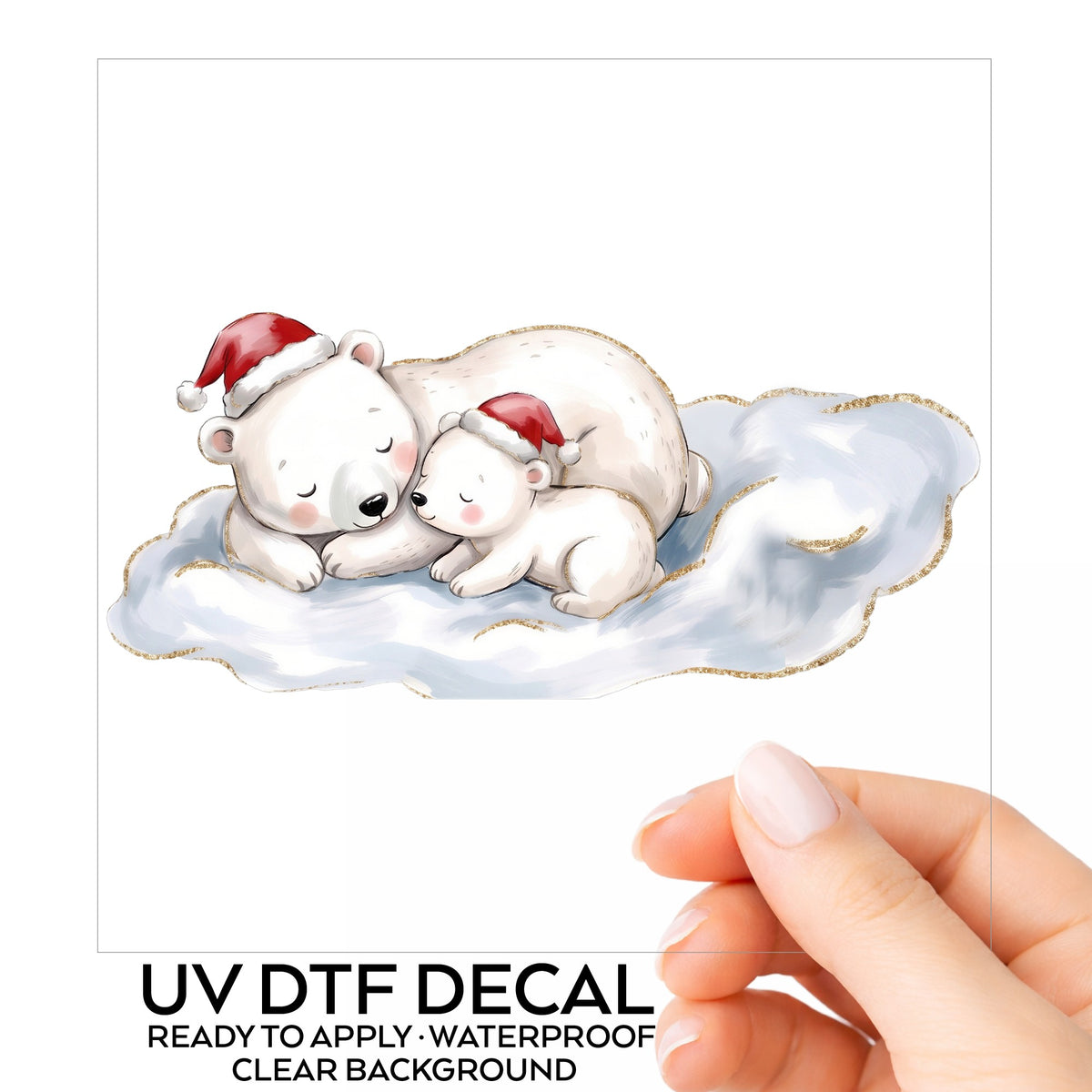 Sleeping Polar Bear And Cub In Santa Hats UV DTF sticker on its backing card, held in hand