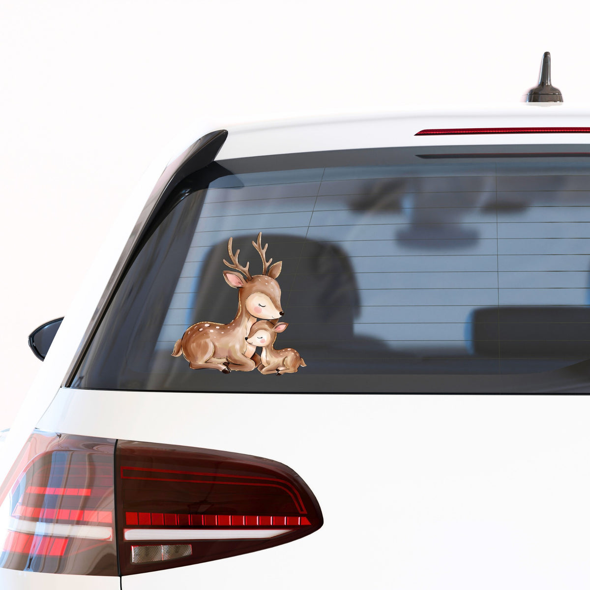 Mother Deer And Fawn UV DTF sticker applied to the rear window of a white car
