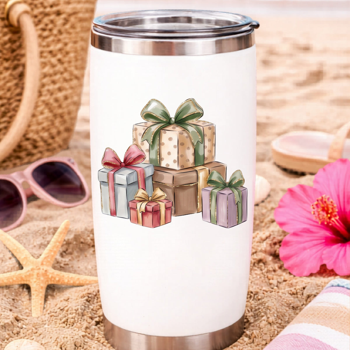 Pastel Gift Box Stack UV DTF sticker applied to a white travel tumbler on beach sand