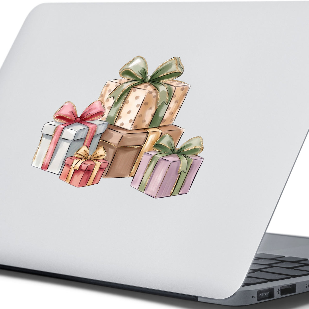 Pastel Gift Box Stack UV DTF sticker applied to the lid of a silver laptop