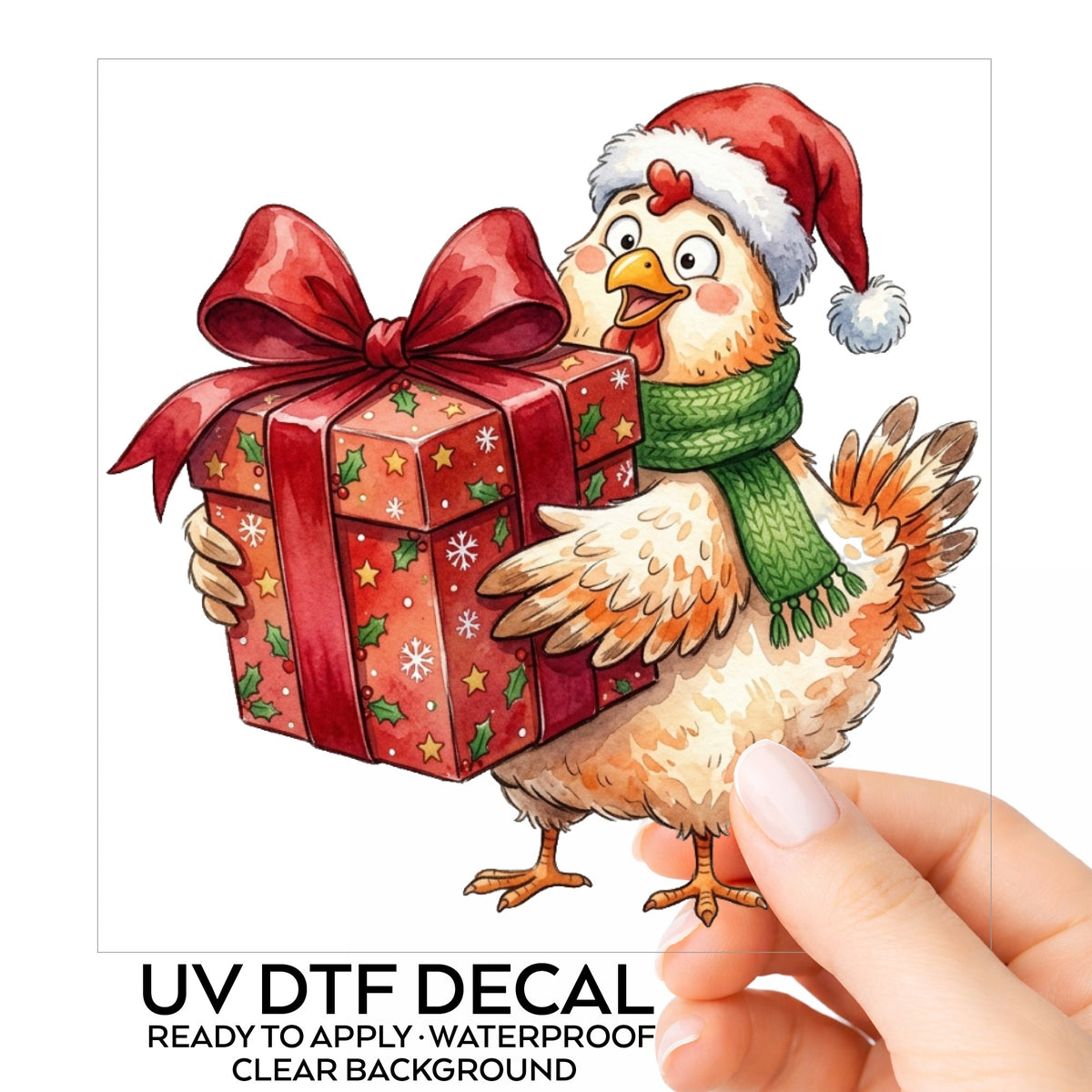 Chicken Carrying Red Christmas Gift UV DTF sticker on its backing card, held in hand