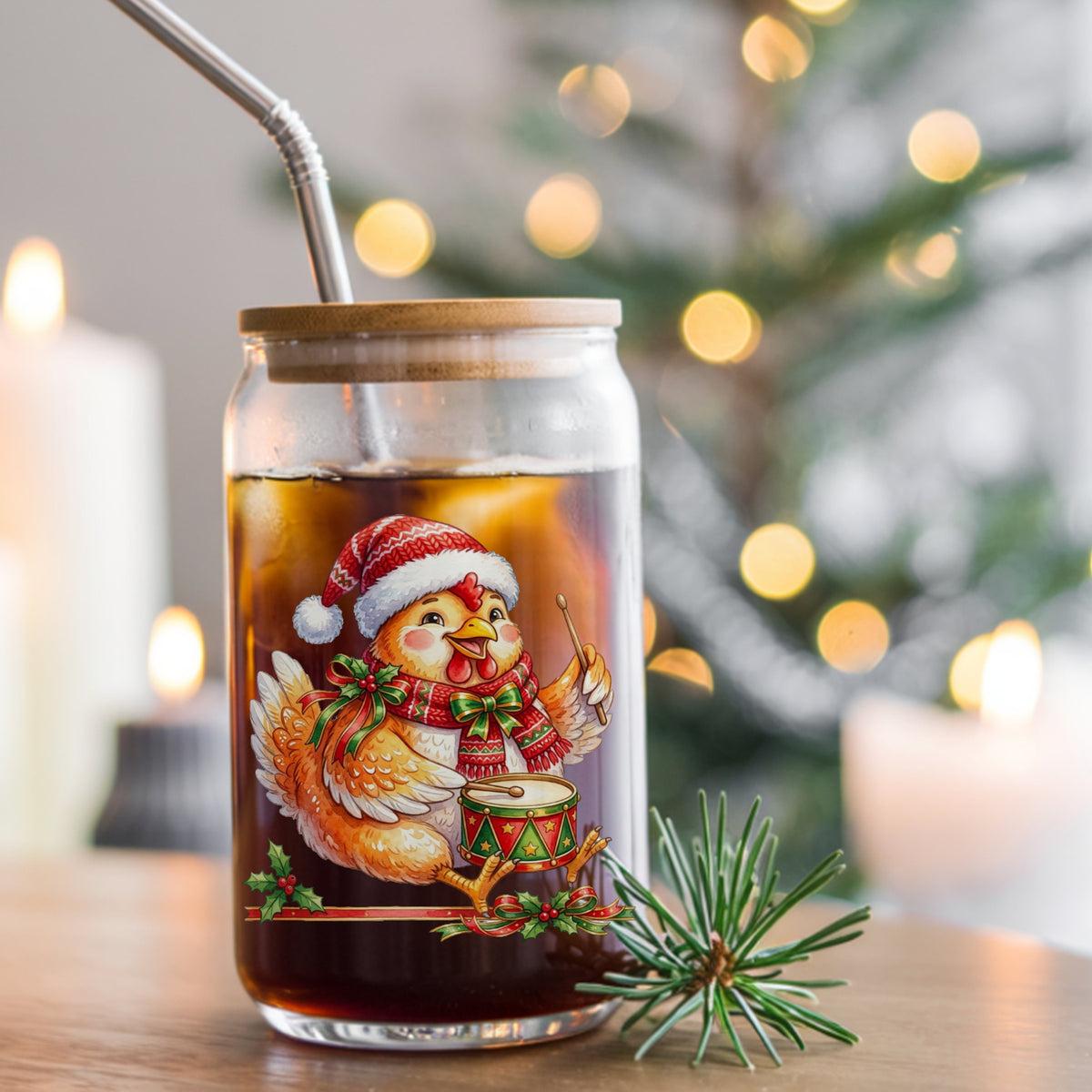 Rooster Playing Christmas Drum UV DTF sticker applied to a glass can cup of iced coffee with a straw