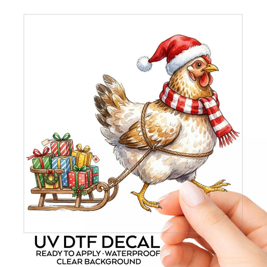 Chicken Pulling Sled Of Presents UV DTF sticker on its backing card, held in hand