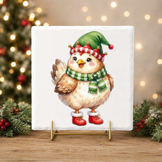 Elf Hat Chicken In Red Boots UV DTF sticker applied to a white tile on a gold stand