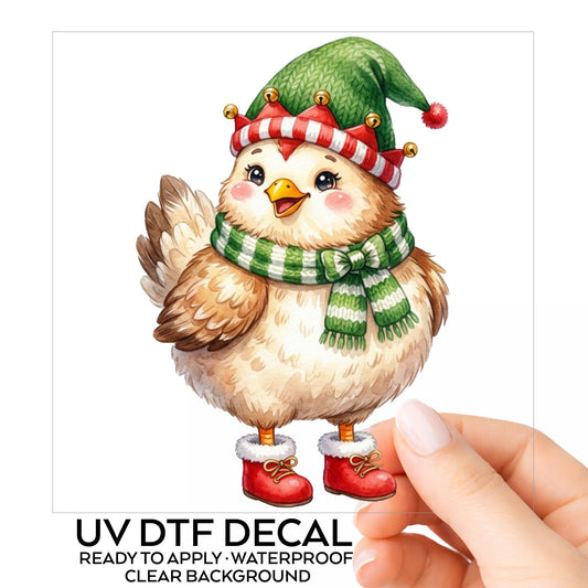 Elf Hat Chicken In Red Boots UV DTF sticker on its backing card, held in hand
