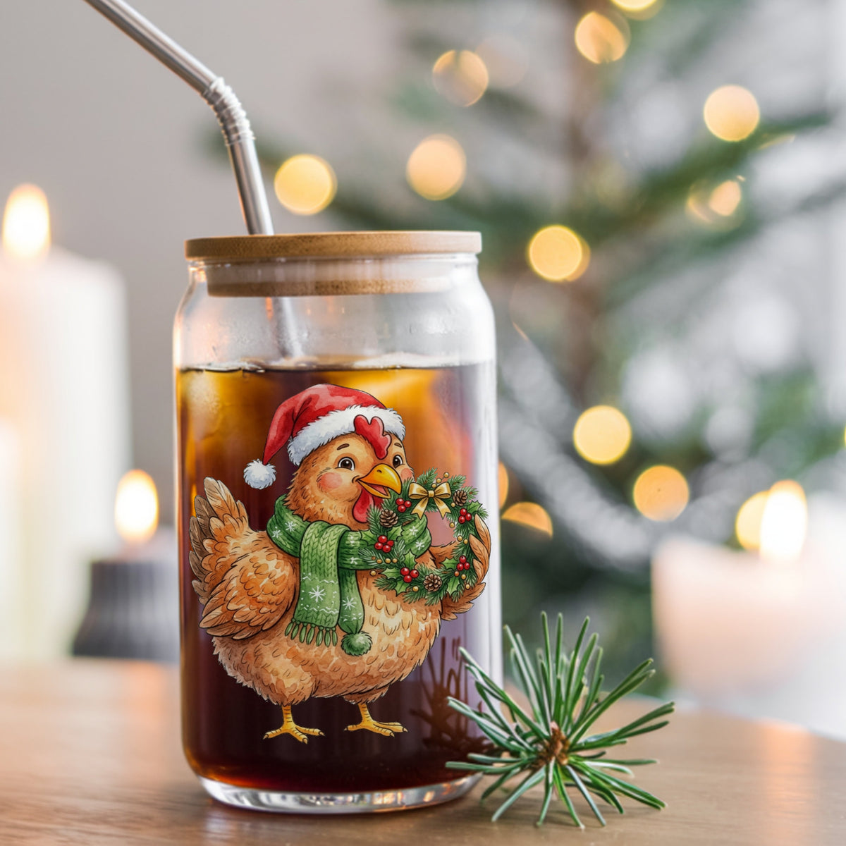 Hen Holding Holly Wreath UV DTF sticker applied to a glass can cup of iced coffee with a straw
