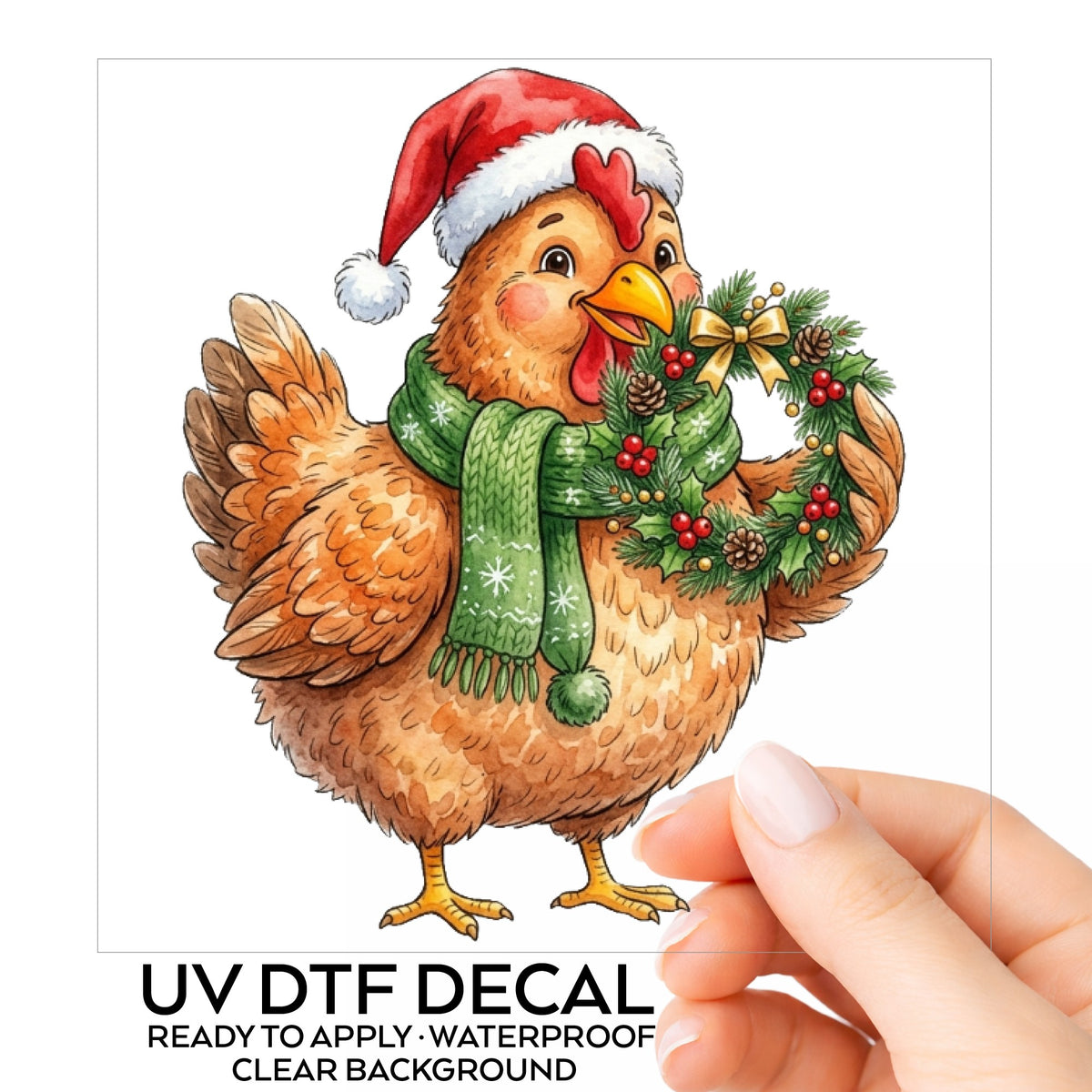 Hen Holding Holly Wreath UV DTF sticker on its backing card, held in hand