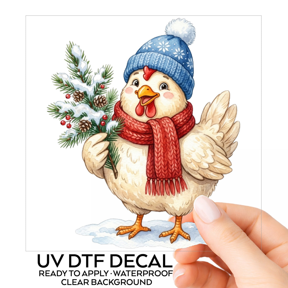 Blue Beanie Chicken With Pine Branch UV DTF sticker on its backing card, held in hand