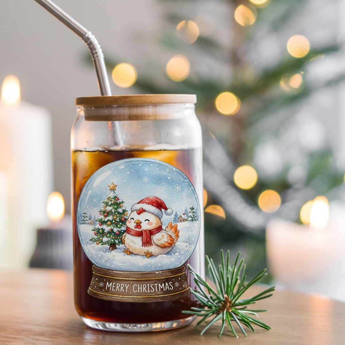Merry Christmas Snow Globe Chicken UV DTF sticker applied to a glass can cup of iced coffee with a straw