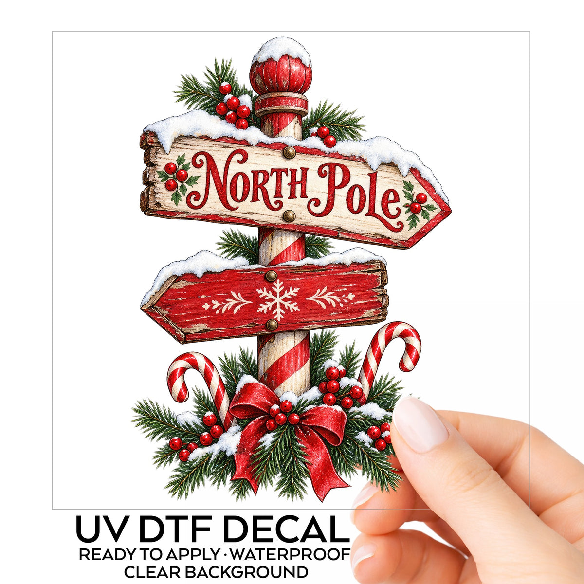 North Pole Sign UV DTF sticker on its backing card, held in hand